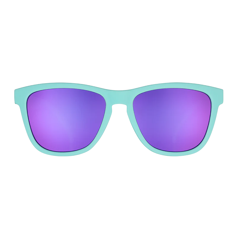 goodr OG Electric Dinotopia Carnival sunglasses, sky blue frame with lavender lenses — front view