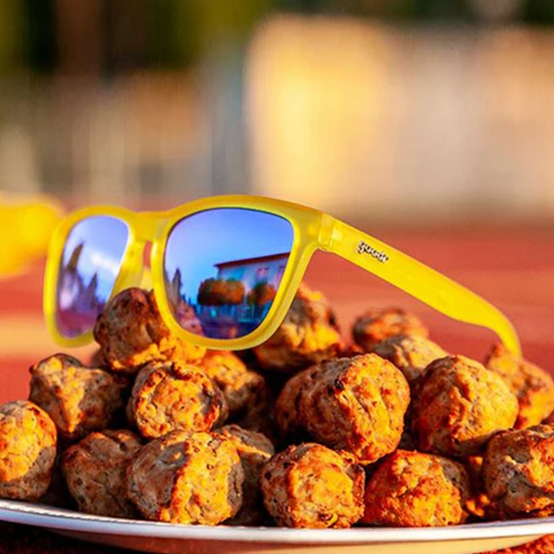 goodr OG Swedish Meatball Hangover sunglasses, lemon-lime frame with ice blue lenses — styled product view