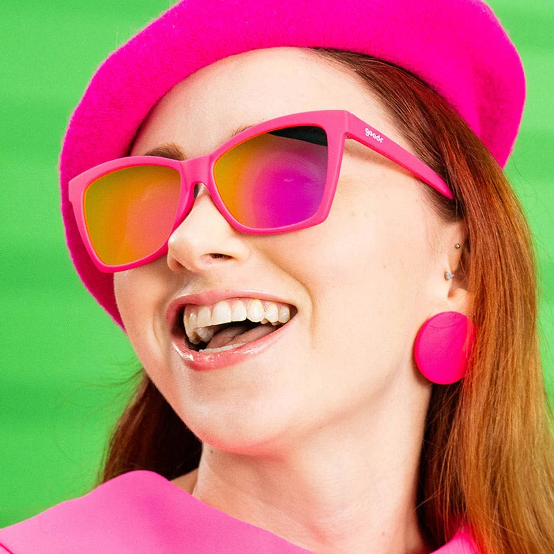 goodr Pop G Approaching Cult Status sunglasses, fuchsia frame with mirrored magenta lenses — styled product view