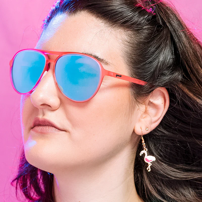 goodr Mach G Carl Is My Co-Pilot sunglasses, pink frame with mirrored light blue lenses — styled product view
