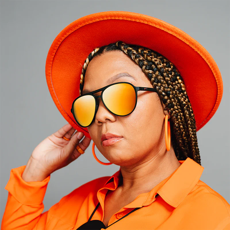 goodr Mach G Call Me Tarmac Daddy sunglasses, smoke frame with mirrored amber lenses — styled product view