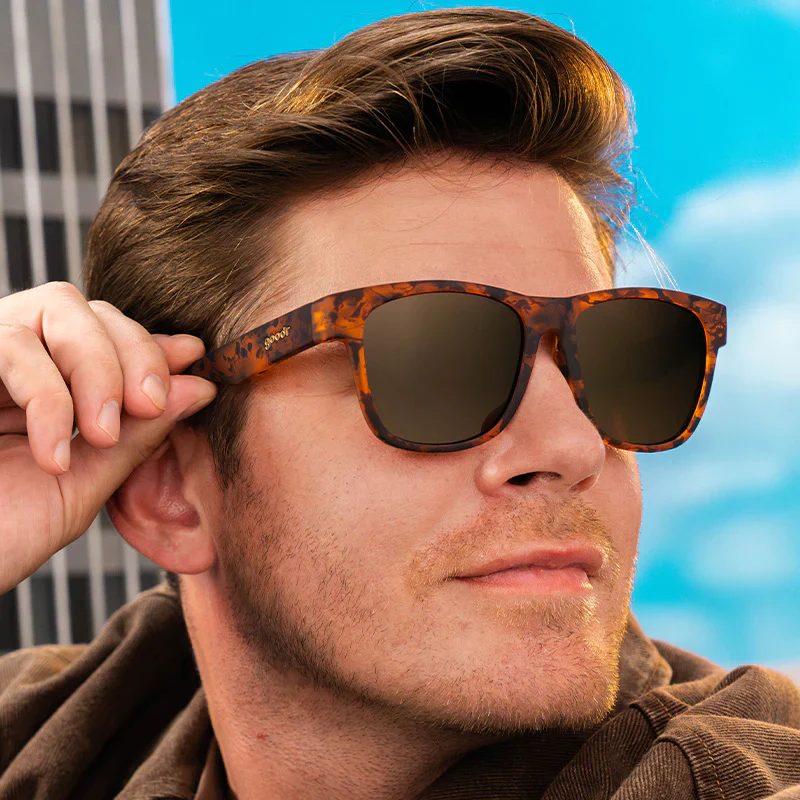goodr BFG Hellhound Hallucinations sunglasses, burgundy frame with brown lenses — styled product view