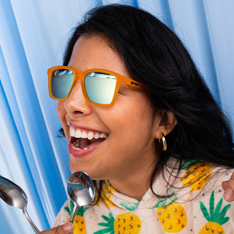 goodr LFG Never The Big Spoon sunglasses, amber frame with mirrored cream lenses — styled product view