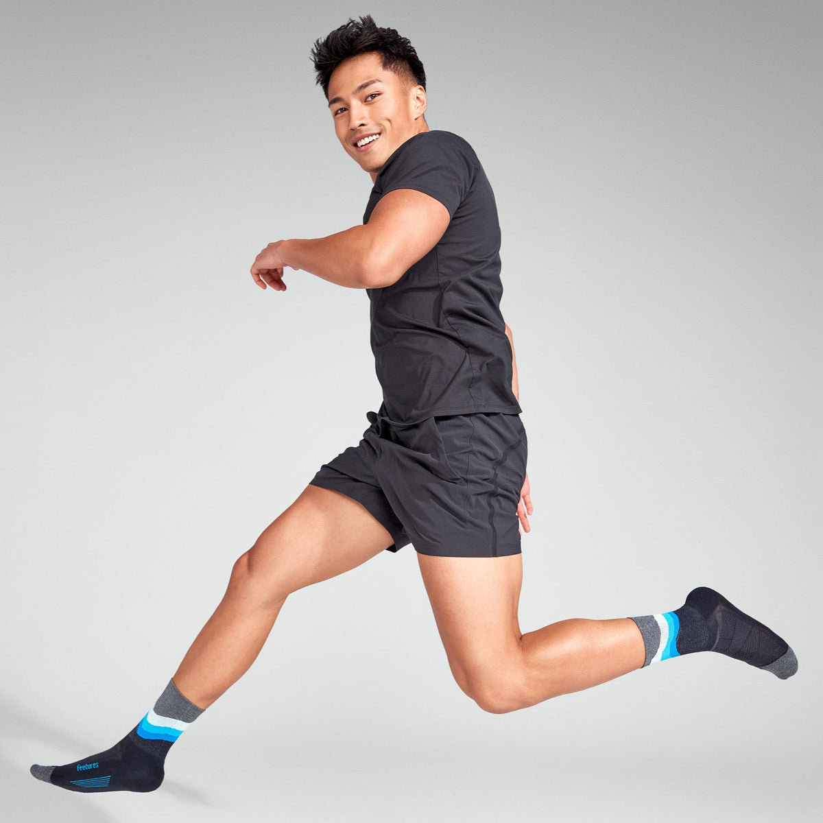 Feetures Elite Light Cushion Mini Crew sock in Black Swell — heel detail #Color_Black Swell