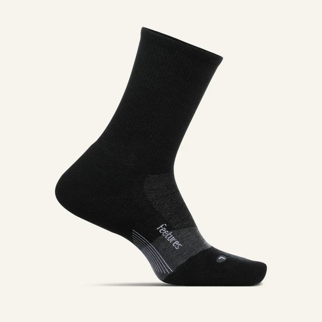 Feetures Merino 10 Ultra Light Cushion Mini Crew sock in Black — front view #Color_Black