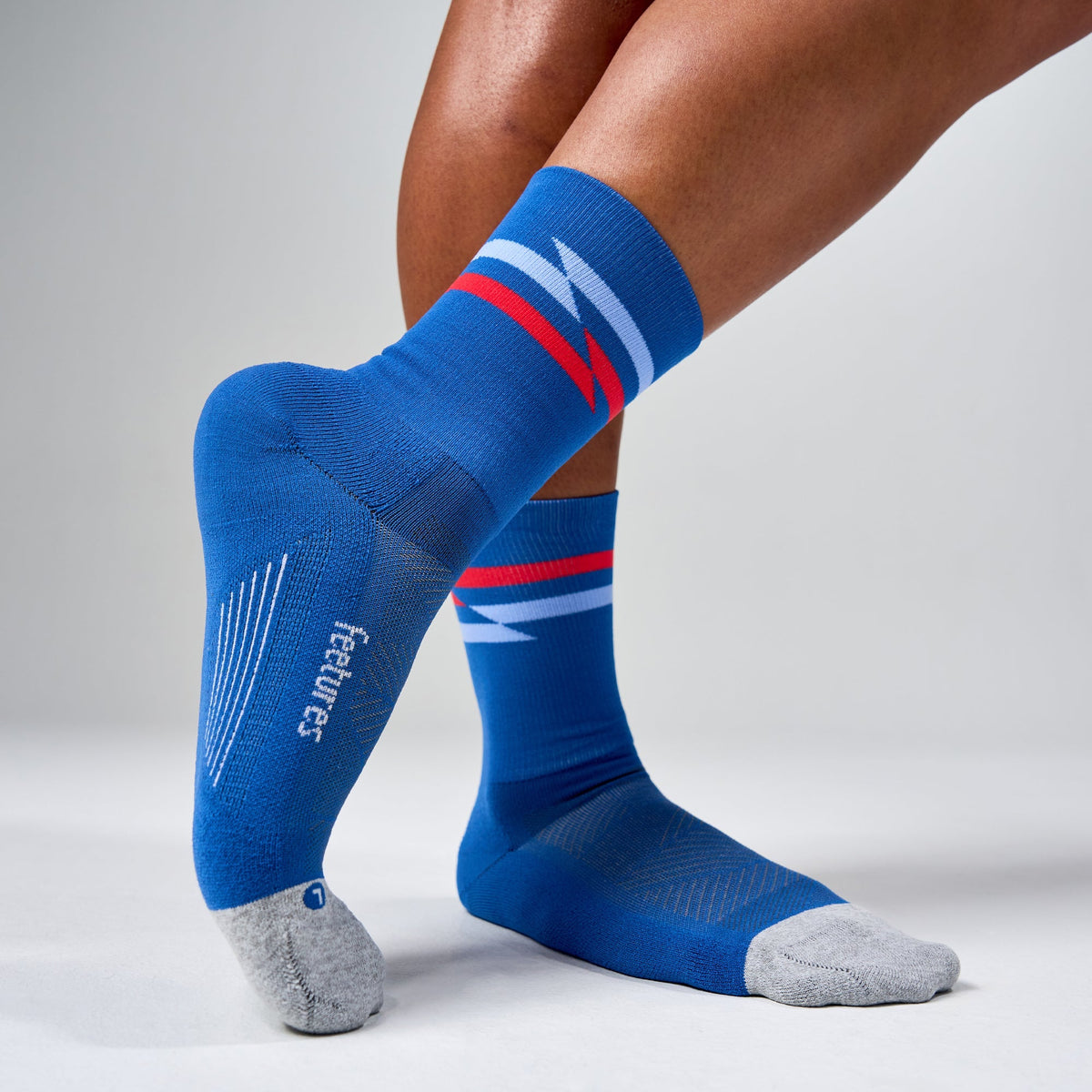 Feetures Elite Light Cushion Mini Crew sock in Blue Track — heel detail #Color_Blue Track