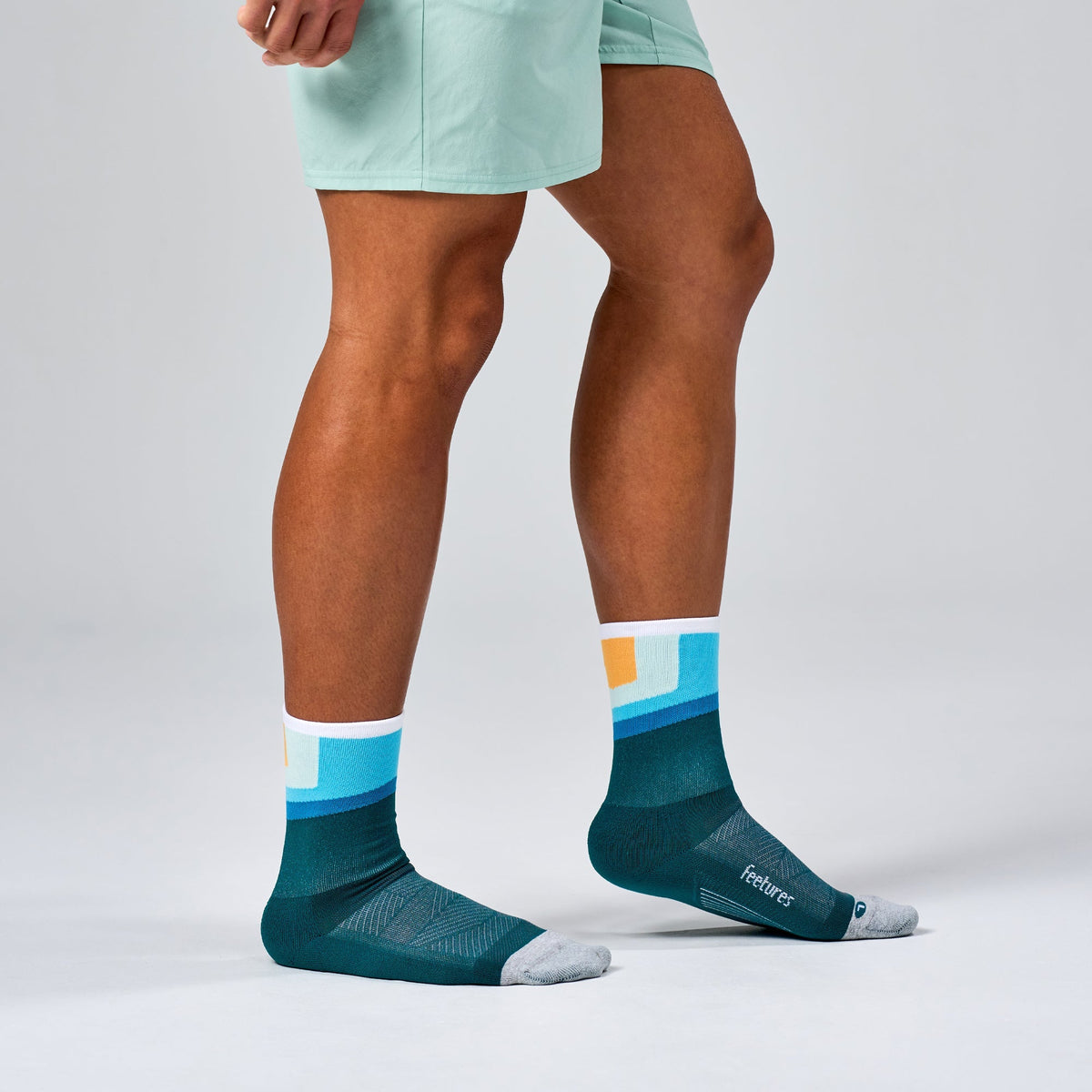 Feetures Elite Light Cushion Mini Crew sock in Breezy Court — heel detail #Color_Breezy Court