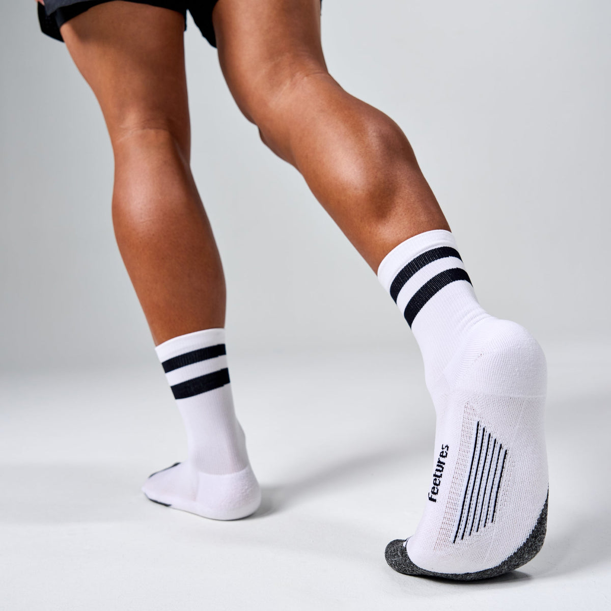 Feetures Elite Light Cushion Mini Crew sock in White High Top Stripe — heel detail #Color_White High Top Stripe