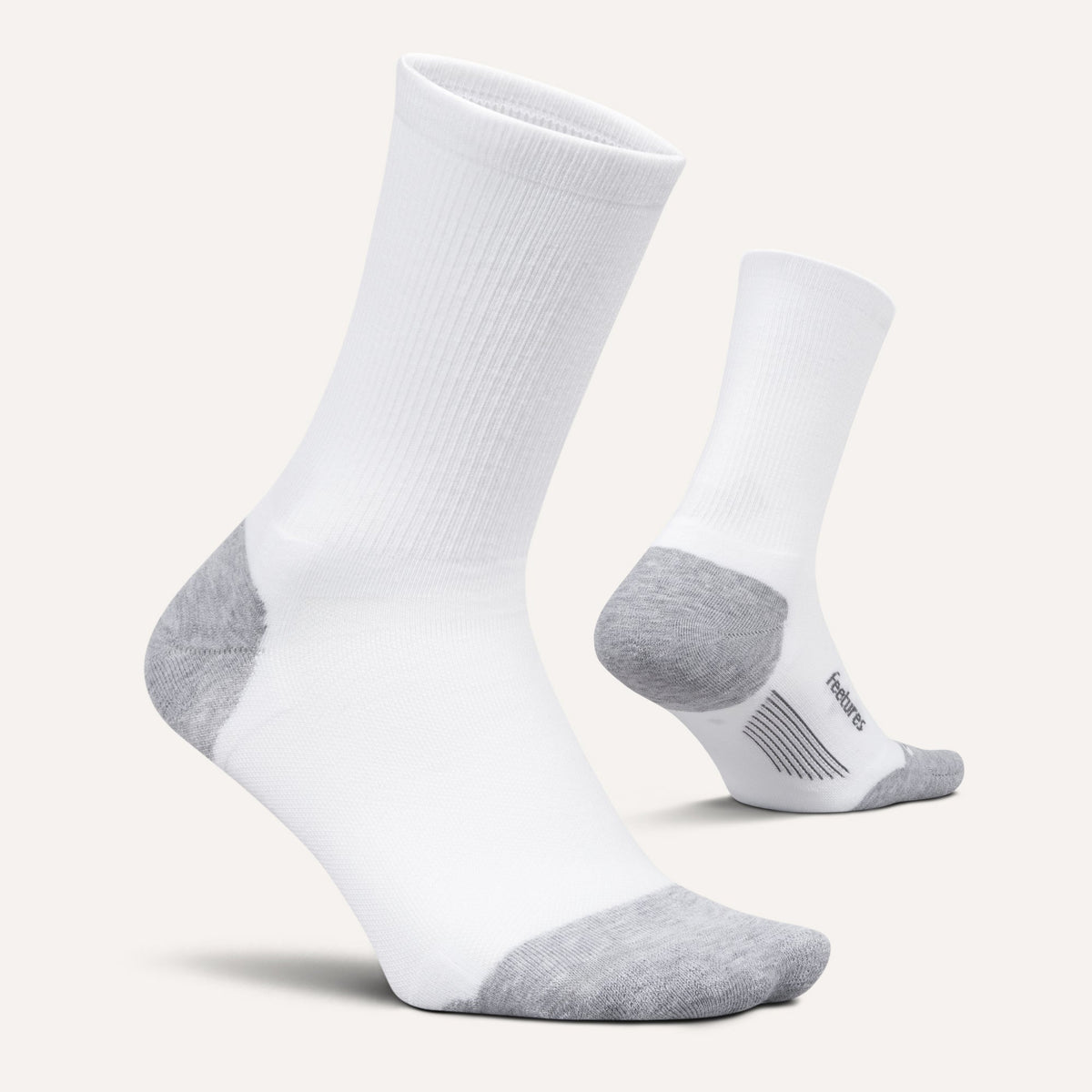 Feetures Elite Max Cushion Mini Crew sock in White — pair view #Color_White