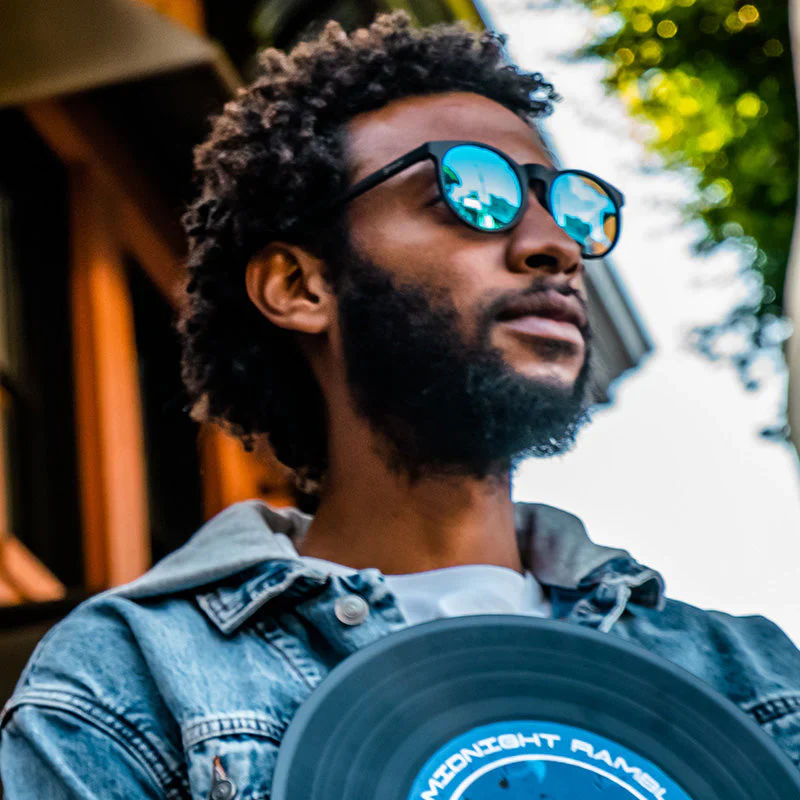 goodr Circle G Midnight Ramble At Circle Bar sunglasses, charcoal frame with mirrored teal lenses — styled product view