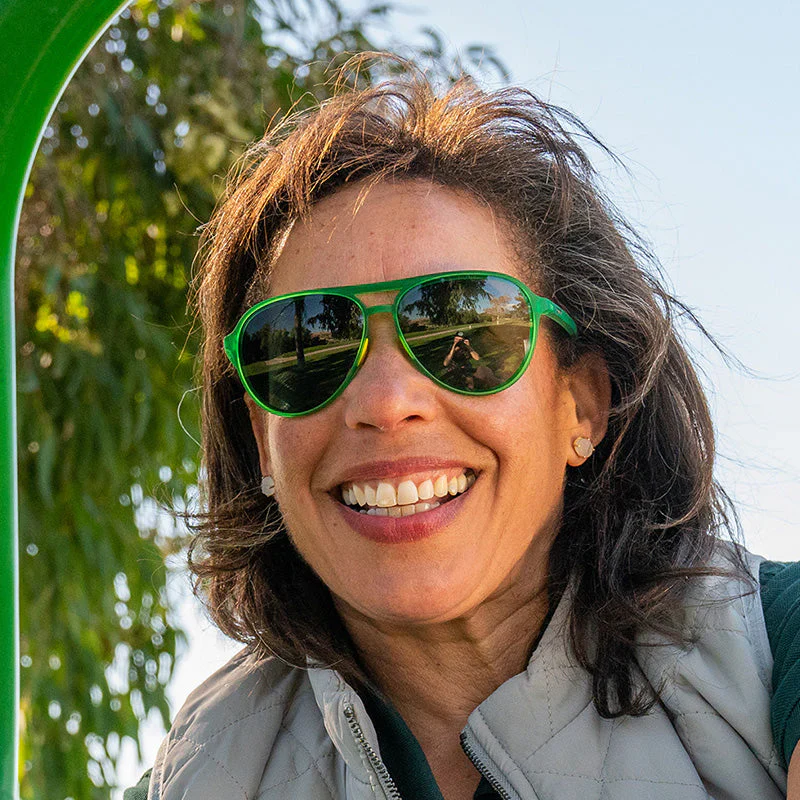 goodr Mach G Tales From The Greenskeeper sunglasses, forest frame with mirrored graphite lenses — styled product view