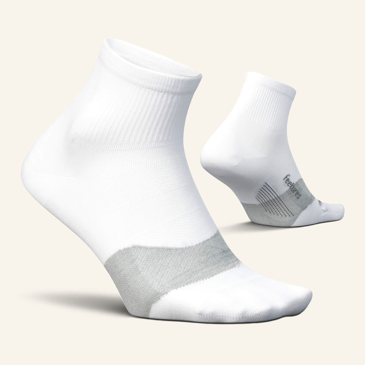 Feetures Elite Ultra Light Cushion Quarter sock in White — pair view #Colour_White