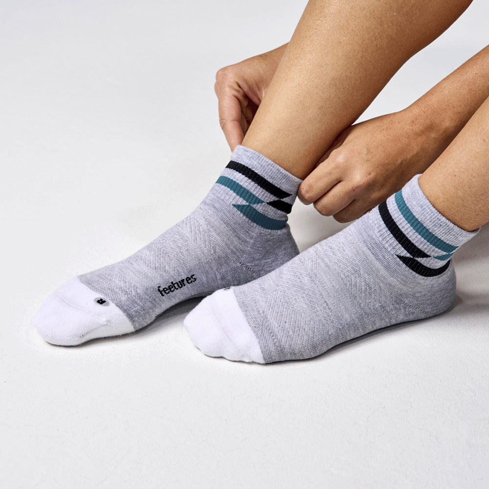 Feetures Elite Max Cushion Quarter sock in Gray Track — lifestyle #Colour_Gray Track