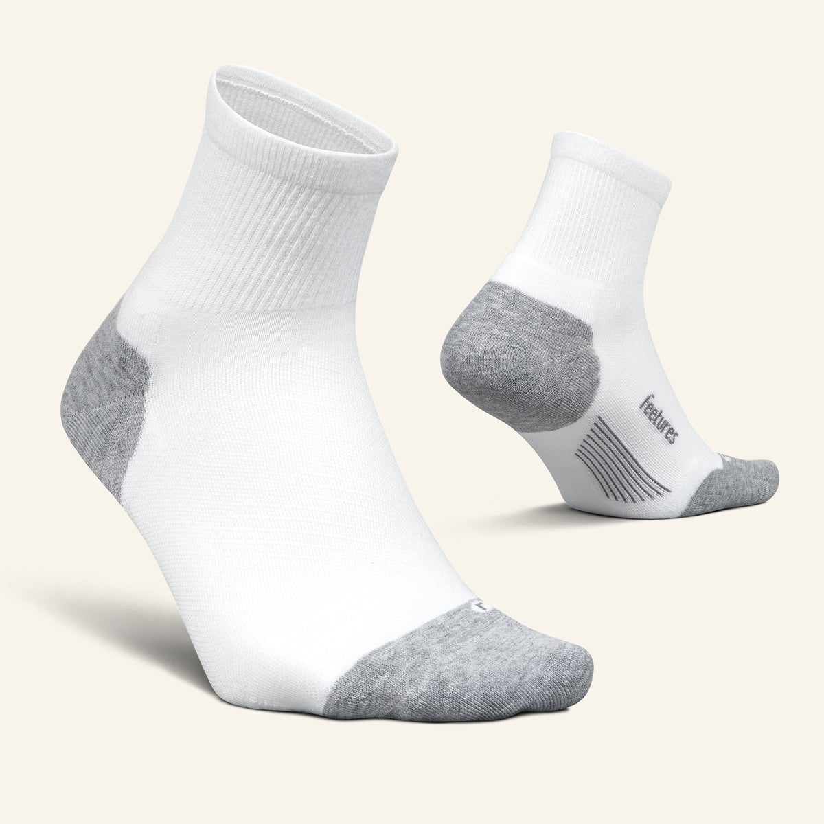 Feetures Elite Max Cushion Quarter sock in White — pair view #Colour_White