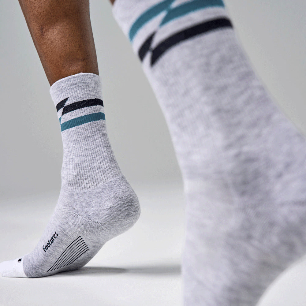 Feetures Elite Max Cushion Mini Crew sock in Gray Track — lifestyle #Color_Gray Track