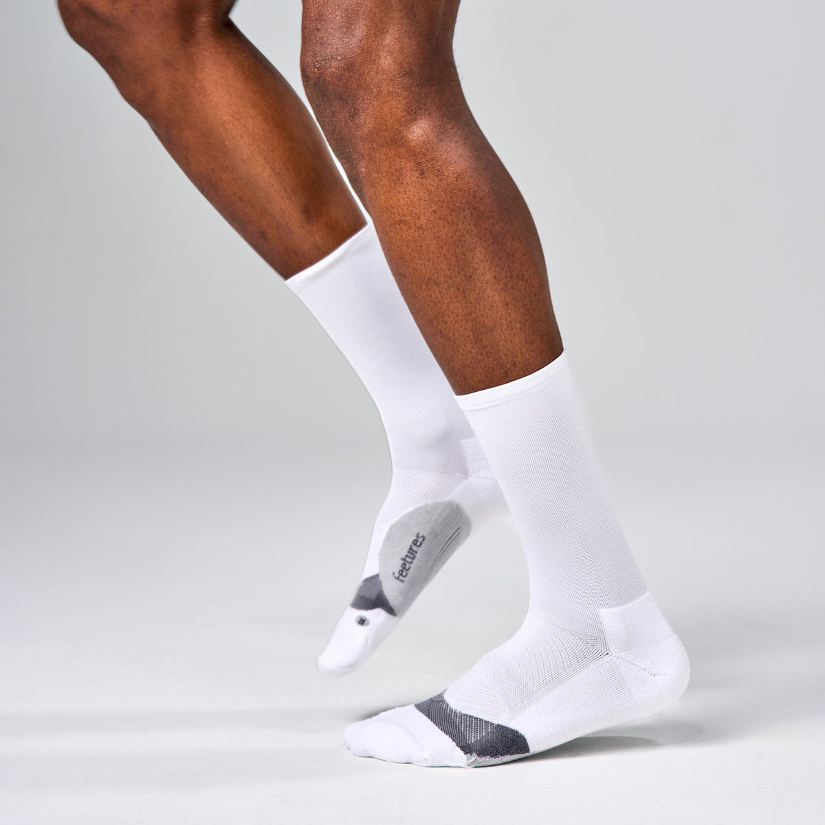 Feetures Elite Light Cushion Mini Crew sock in White — heel detail #Color_White