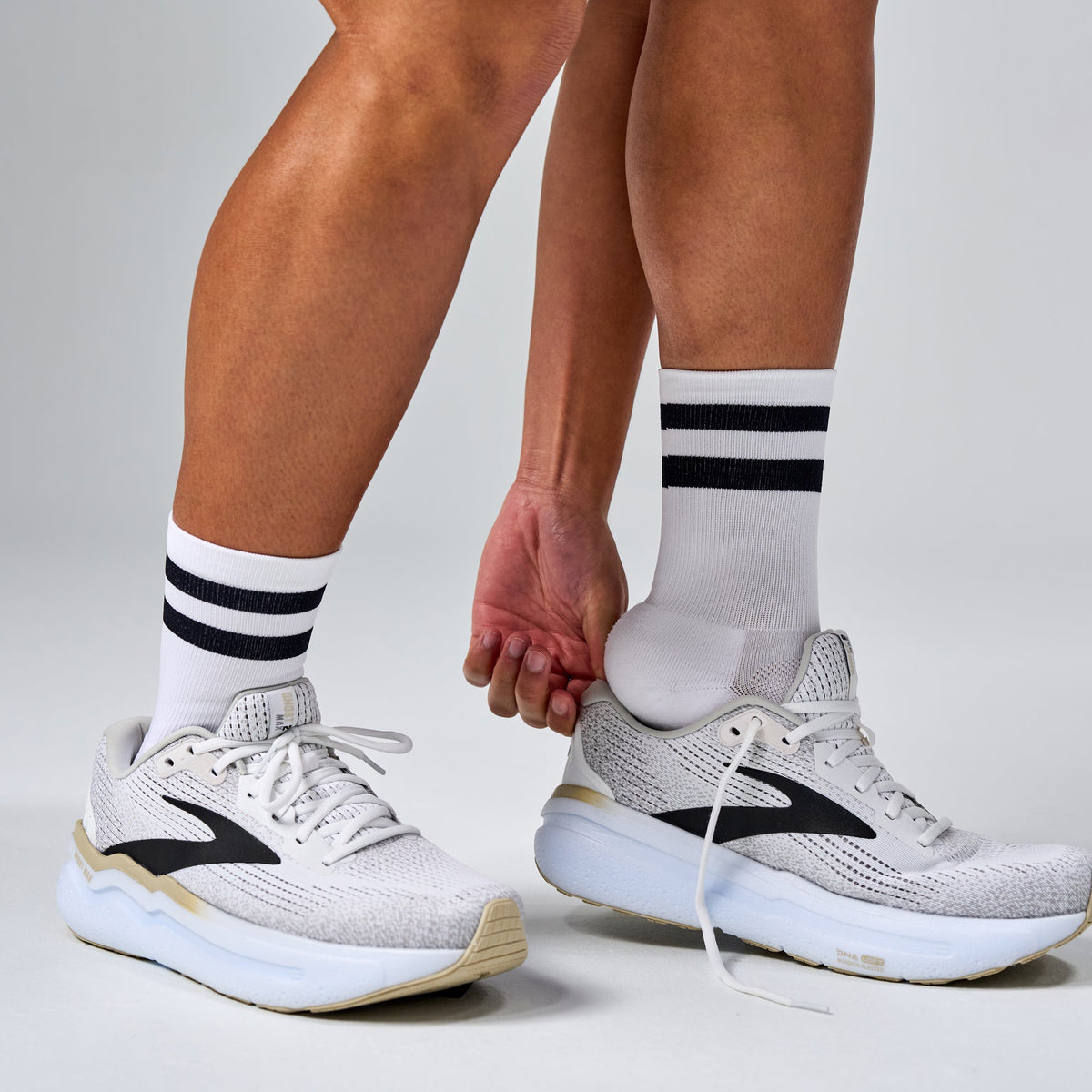 Feetures Elite Light Cushion Mini Crew sock in White High Top Stripe — lifestyle #Color_White High Top Stripe