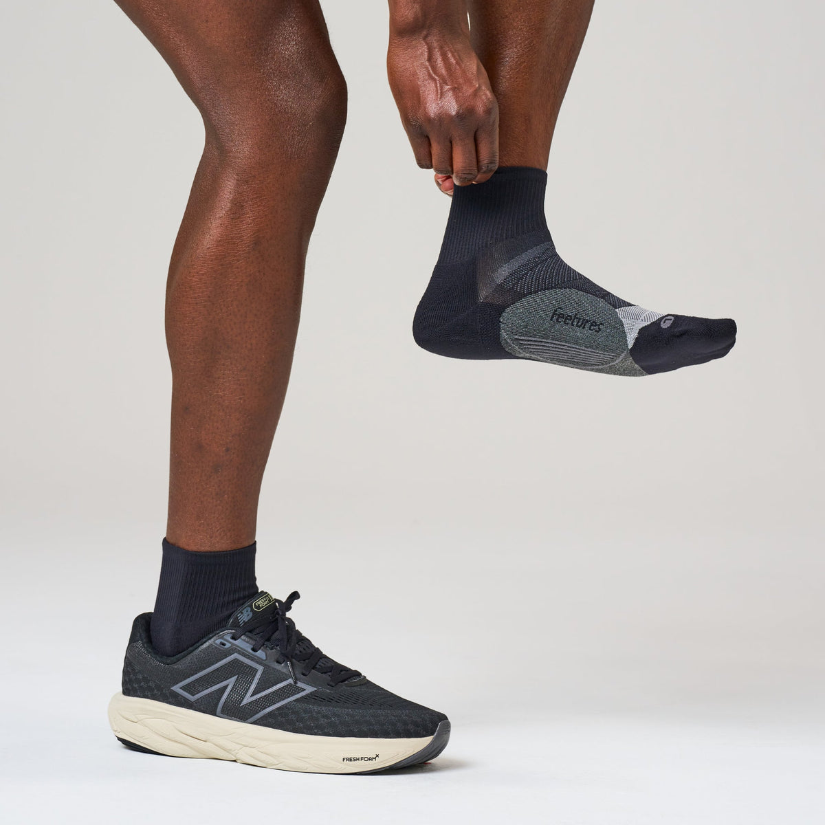 Feetures Elite Light Cushion Quarter sock in Black — lifestyle #Colour_Black