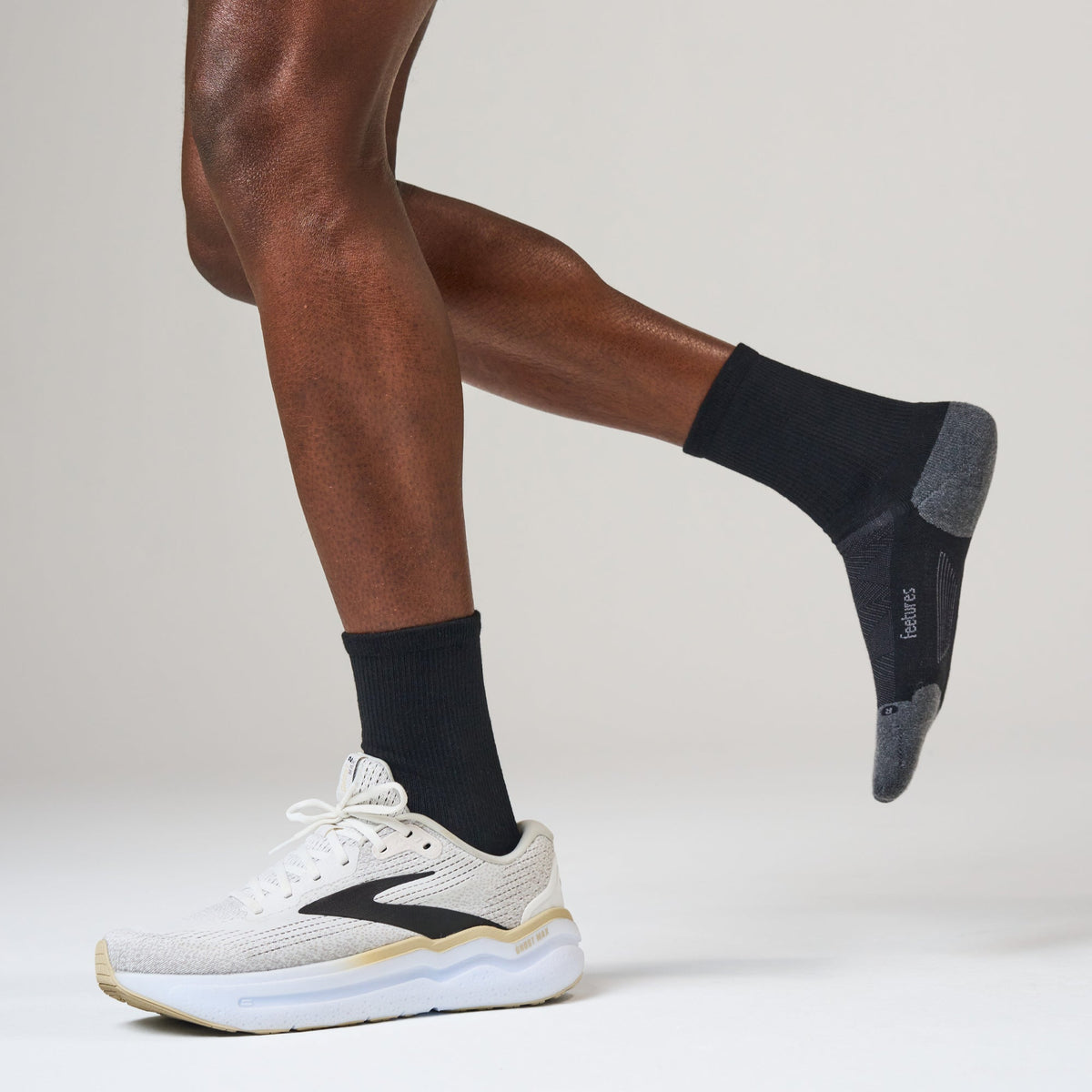 Feetures Elite Max Cushion Mini Crew sock in Black — lifestyle #Color_Black