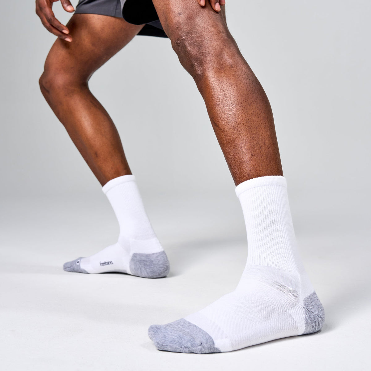 Feetures Elite Max Cushion Mini Crew sock in White — heel detail #Color_White