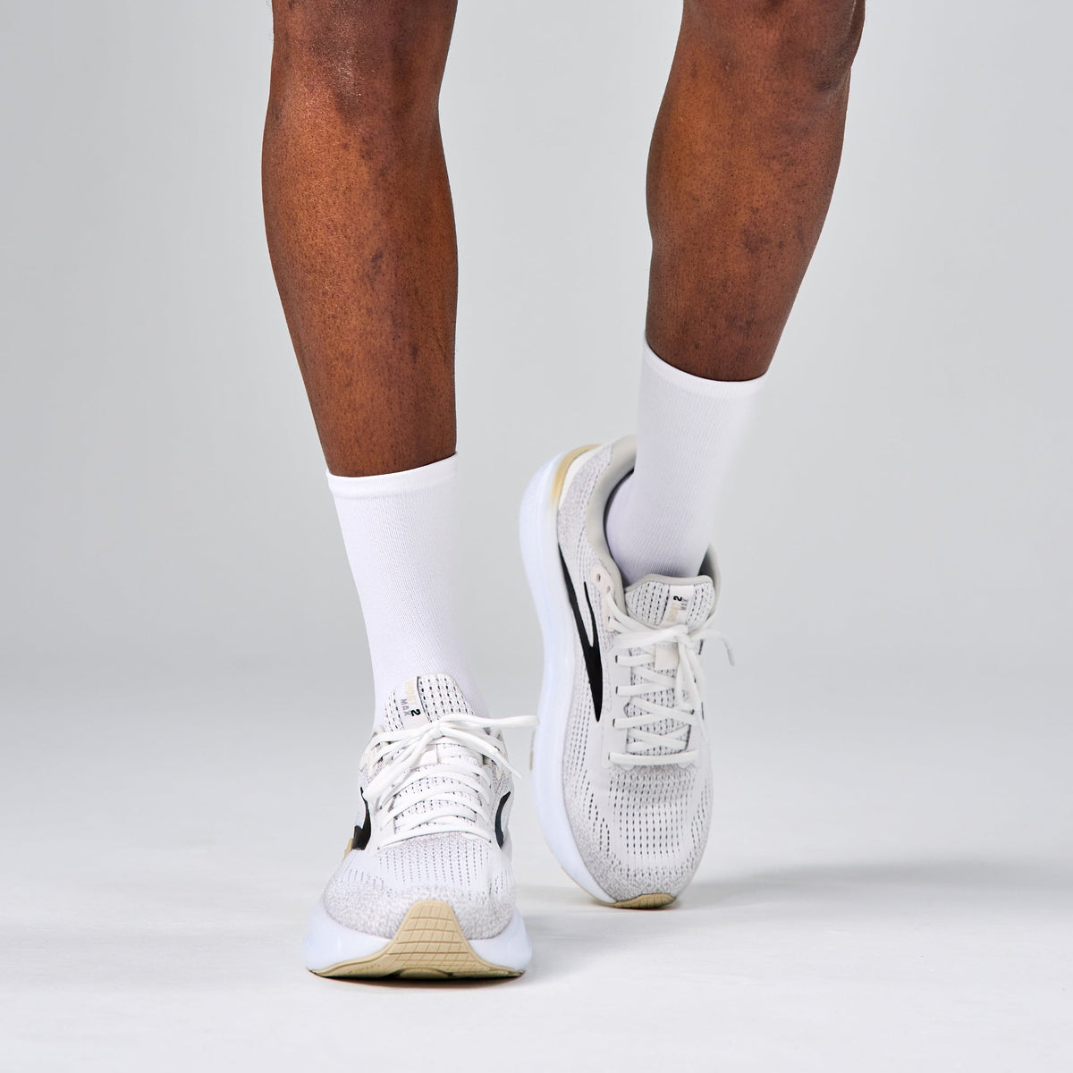 Feetures Elite Max Cushion Mini Crew sock in White — lifestyle #Color_White