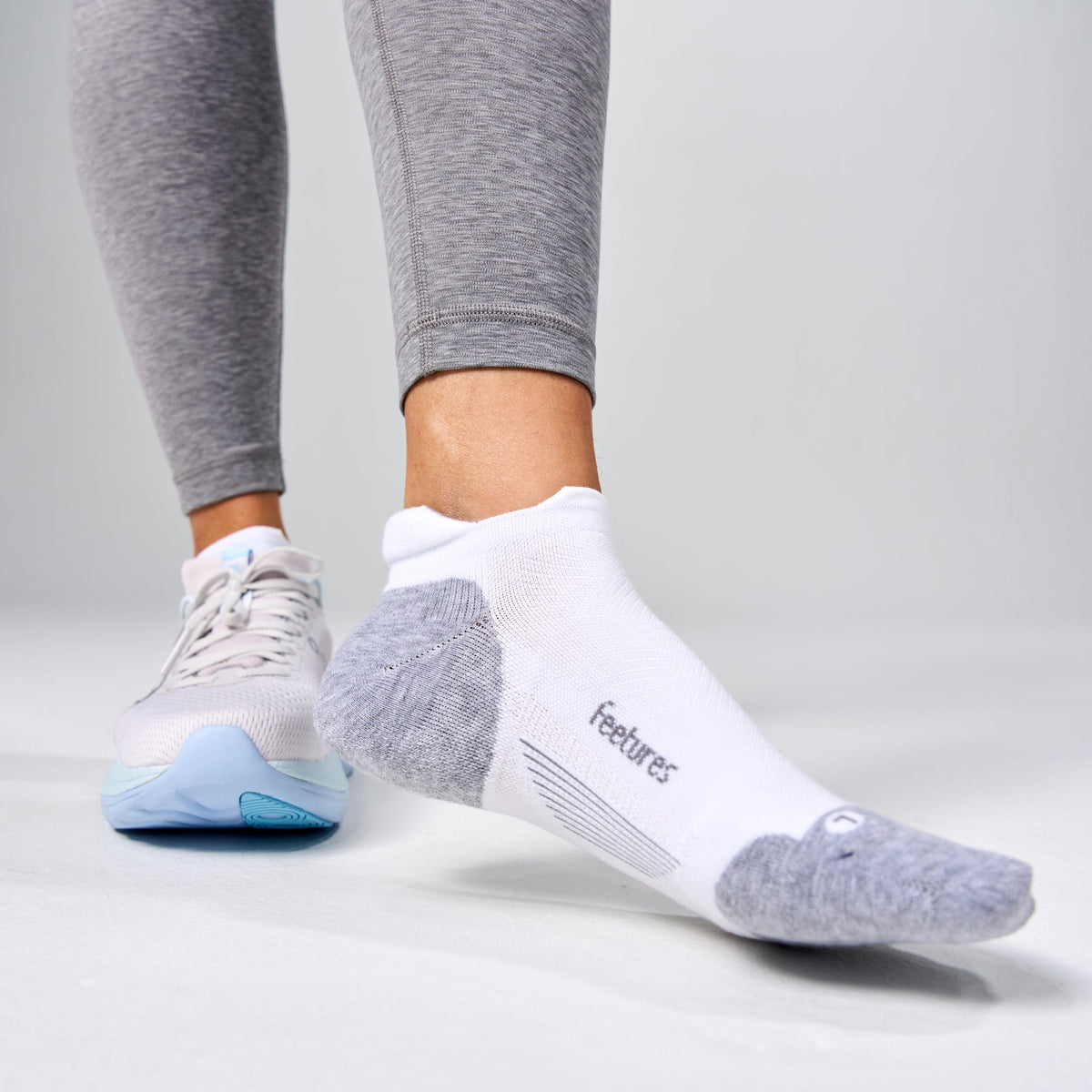 Feetures Elite Max Cushion Tab sock in White — lifestyle #Colour_White