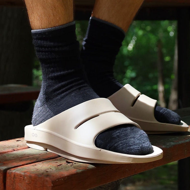 OOFOS OOahh Slide — Nomad, worn close-up #Colour_Nomad