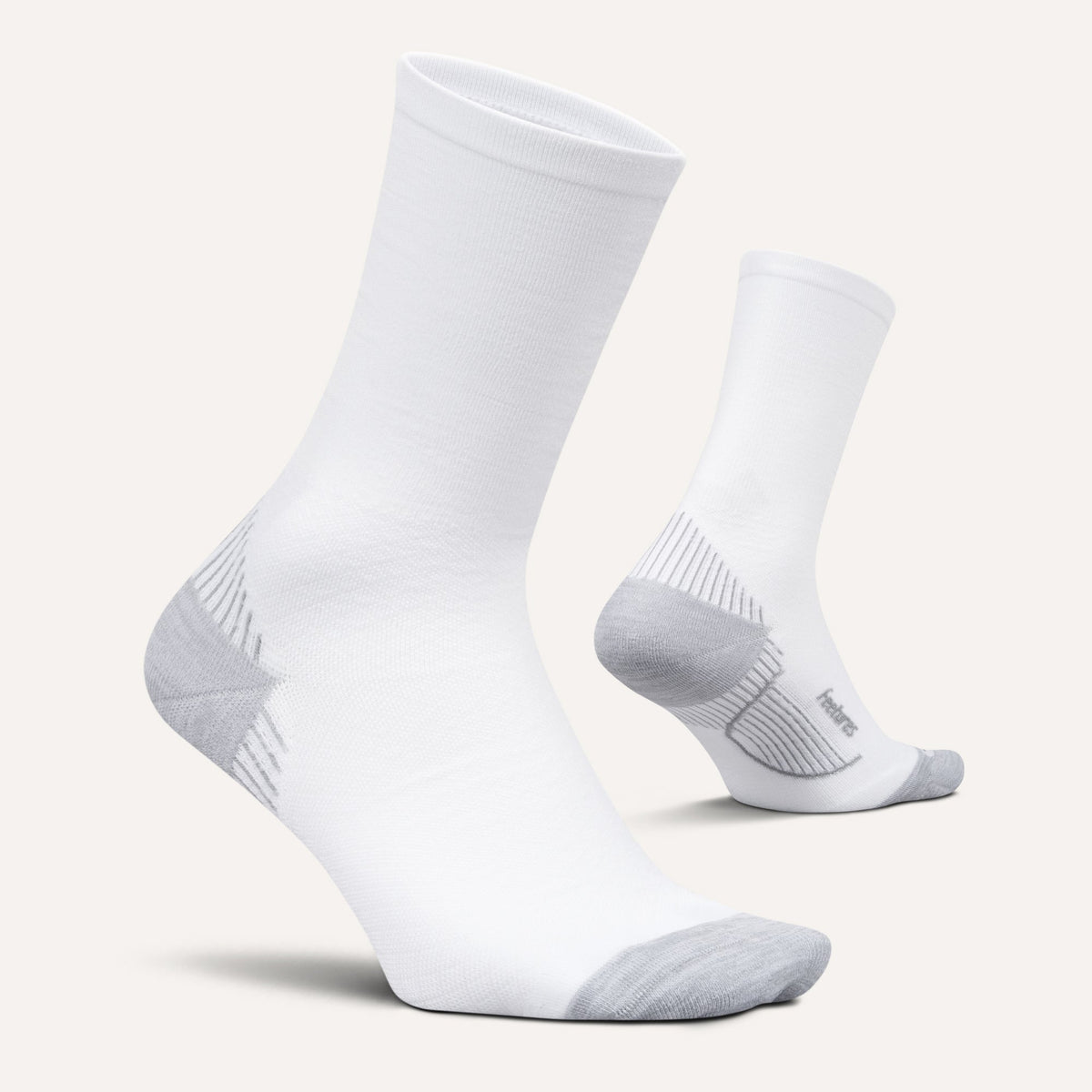 Feetures PF Relief Light Cushion Mini Crew sock in White — pair view #Color_White