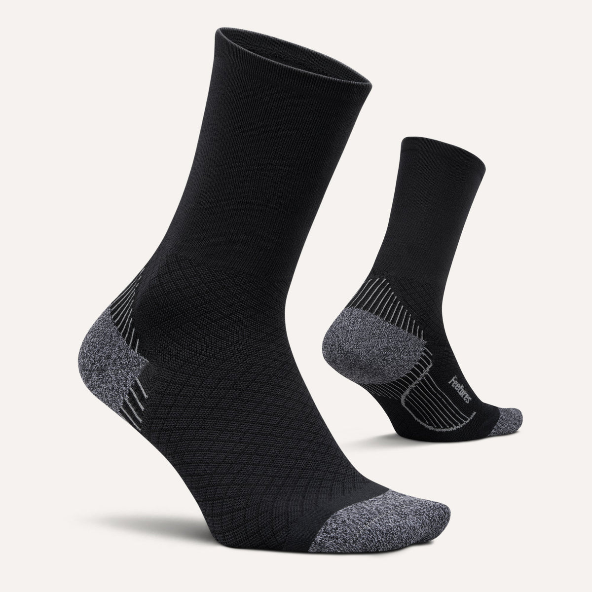 Feetures PF Relief Light Cushion Mini Crew sock in Black — pair view #Color_Black