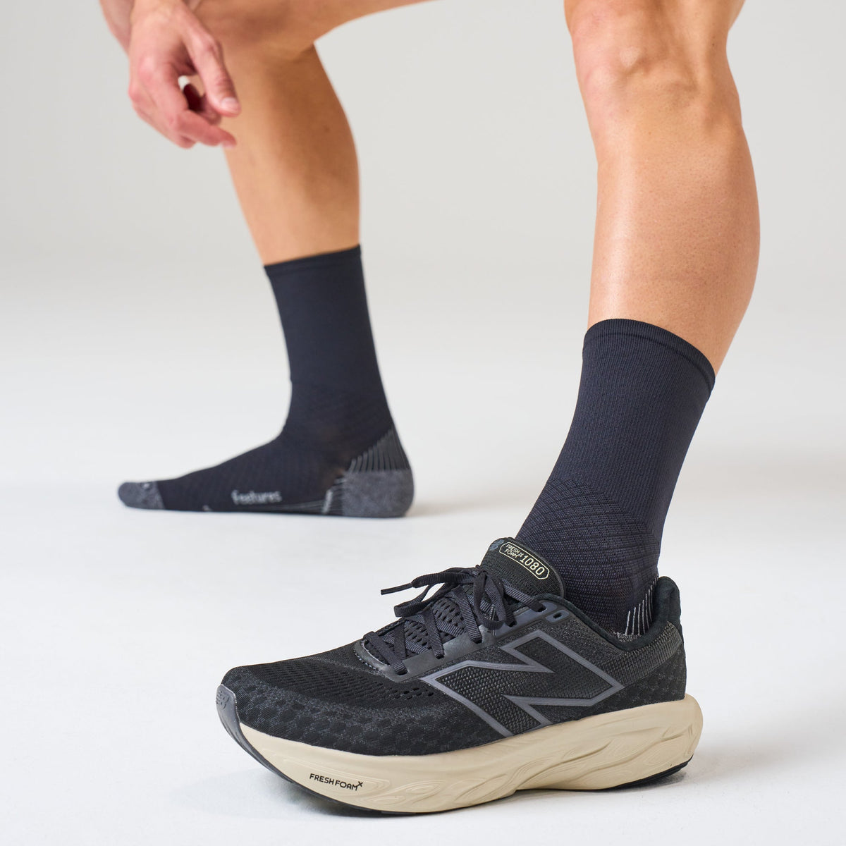 Feetures PF Relief Light Cushion Mini Crew sock in Black — lifestyle #Color_Black