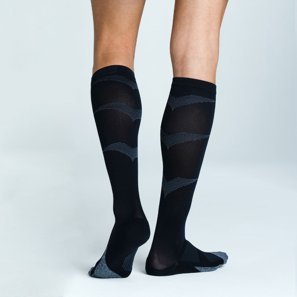 Feetures Graduated Compression Light Cushion Knee High sock in Black — heel detail #Color_Black